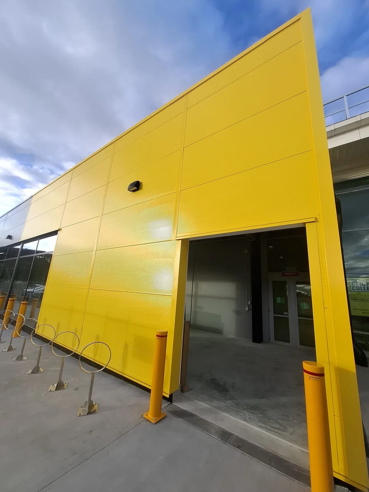Bright yellow commercial entrance cladding