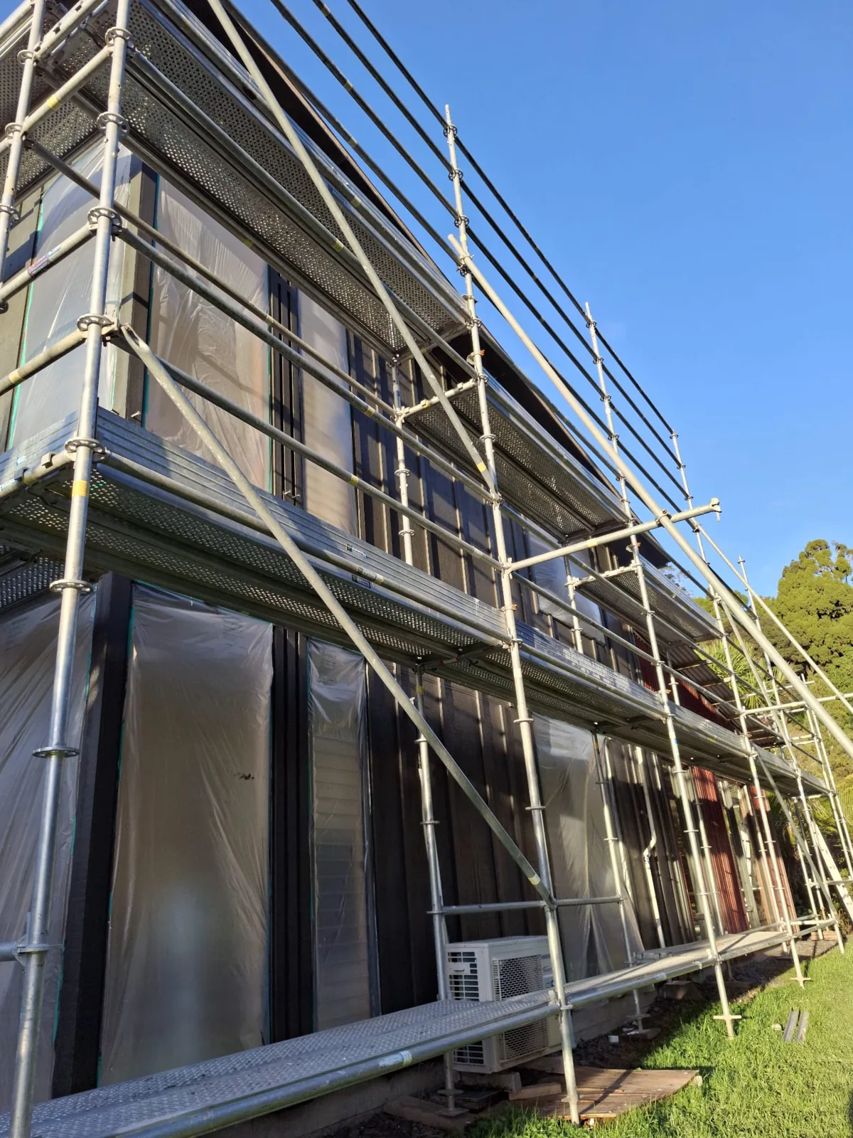 Scaffolded building exterior during repainting