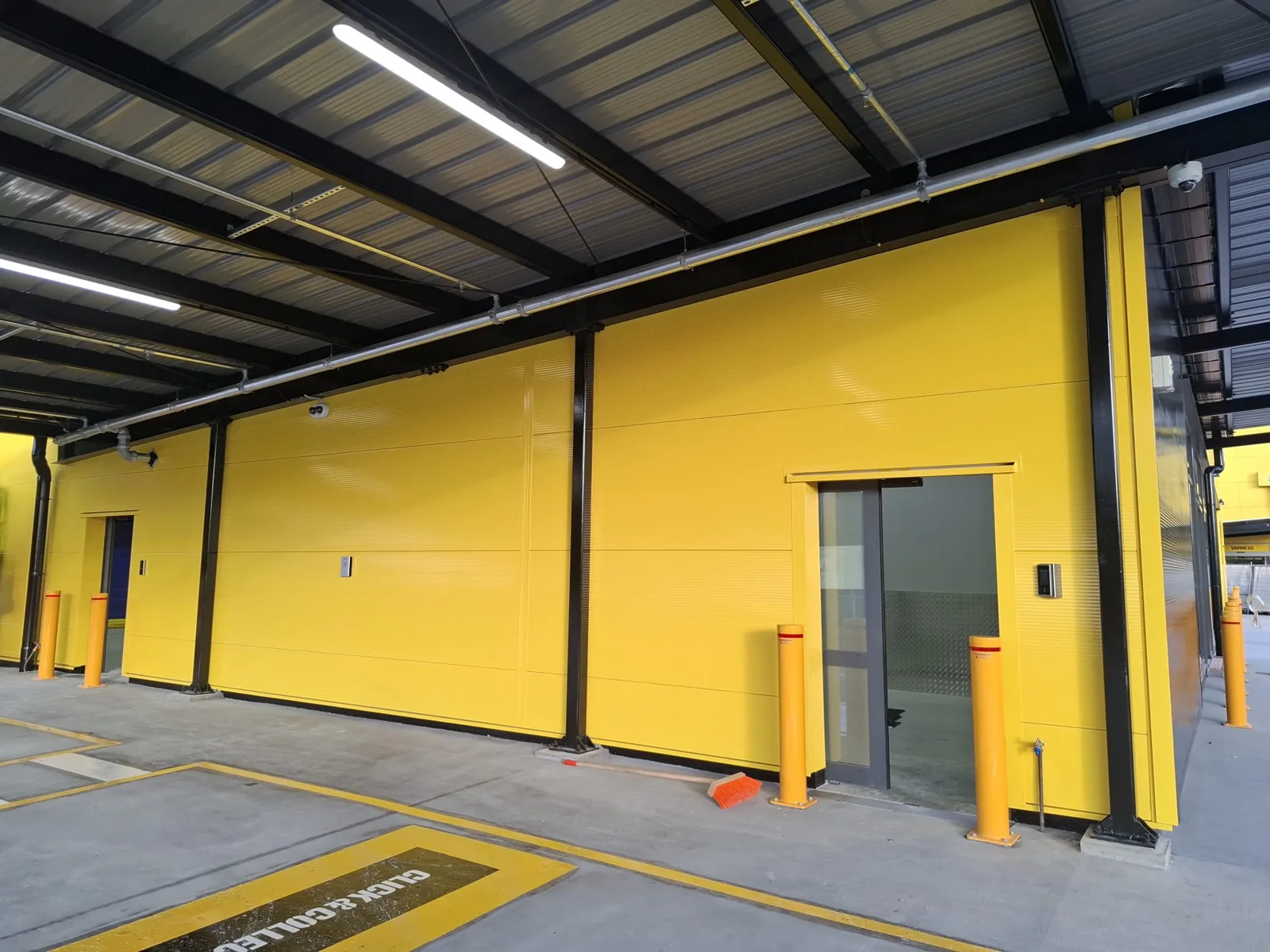 Freshly painted commercial facility in yellow and black