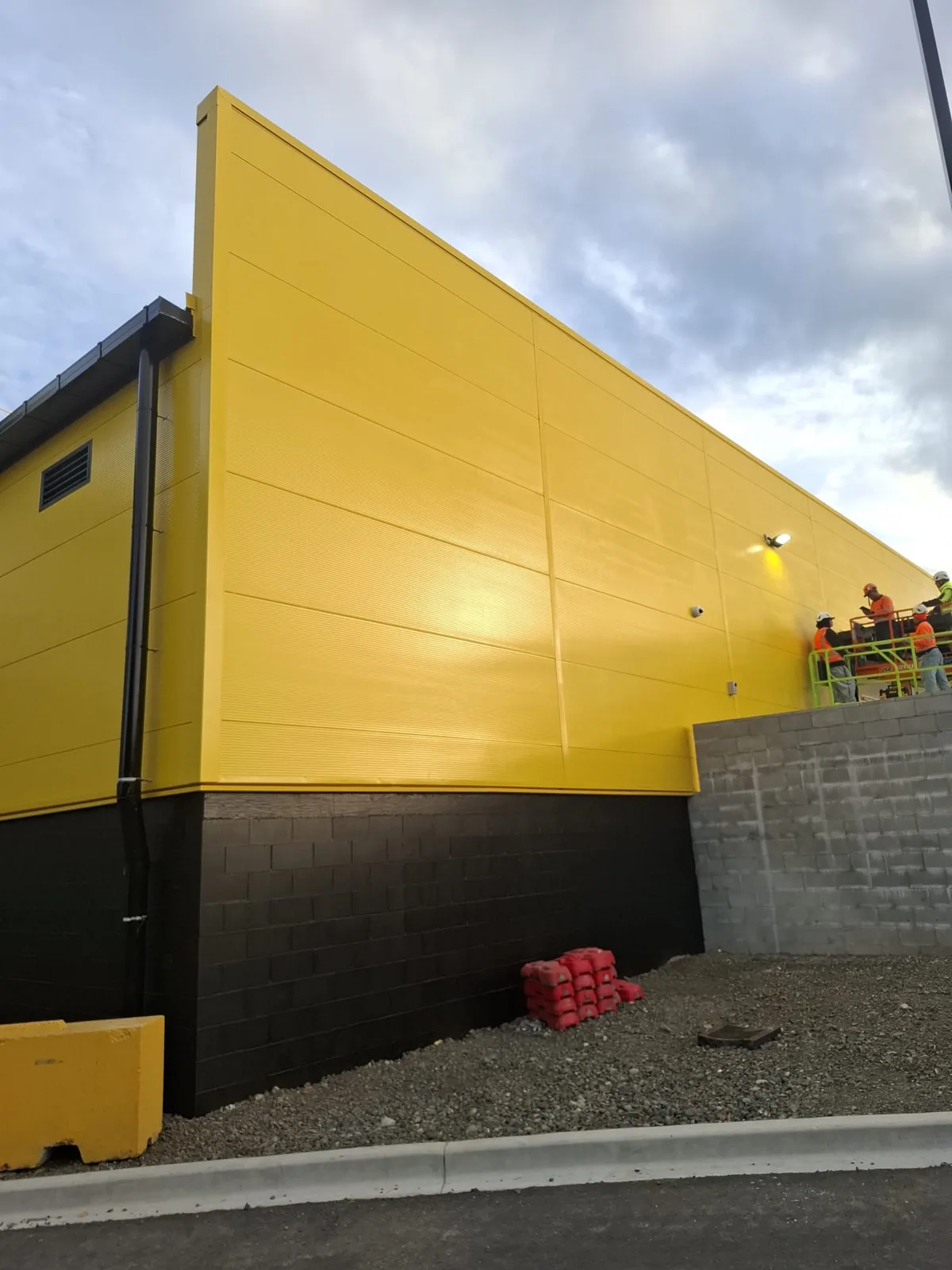 Yellow commercial cladding with a freshly applied protective coating